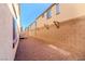 A view of a backyard featuring a gravel-filled lot and cinder block wall at 8523 Peaceful Dreams St, Las Vegas, NV 89139