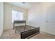 Bedroom with a bed frame and natural light from the windows creating a serene atmosphere at 8523 Peaceful Dreams St, Las Vegas, NV 89139