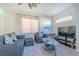 Bright and airy living room with a large window and entertainment setup at 8523 Peaceful Dreams St, Las Vegas, NV 89139