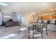 Open concept view of dining area, kitchen, and living room, creating a seamless flow at 8523 Peaceful Dreams St, Las Vegas, NV 89139