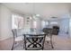 Bright open concept dining area with natural light and view of the connected living area at 8523 Peaceful Dreams St, Las Vegas, NV 89139