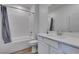 Clean and modern bathroom with white subway tile, and a neutral color scheme at 889 Elmwood Forest Ln, Las Vegas, NV 89138