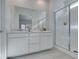 Bright bathroom showcasing a double sink vanity and a glass-enclosed walk-in shower at 889 Elmwood Forest Ln, Las Vegas, NV 89138