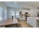 Bright dining area next to kitchen featuring a large table and natural light at 889 Elmwood Forest Ln, Las Vegas, NV 89138