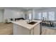 The kitchen island sink overlooks the living and dining room making the space ideal for entertaining at 889 Elmwood Forest Ln, Las Vegas, NV 89138