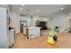 Spacious kitchen flows seamlessly into the living area, complete with island and stainless steel appliances at 889 Elmwood Forest Ln, Las Vegas, NV 89138