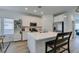 Well-lit kitchen with white cabinets, stainless steel appliances, and center island perfect for meal prep at 889 Elmwood Forest Ln, Las Vegas, NV 89138