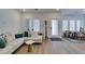 Bright living room featuring a comfortable white sectional sofa and natural light from large windows at 889 Elmwood Forest Ln, Las Vegas, NV 89138