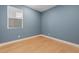 Spacious bedroom with light walls and wood-look flooring at 9062 Lucky Crest St, Las Vegas, NV 89113