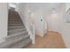 Staircase with gray carpeting and light wood flooring at 9062 Lucky Crest St, Las Vegas, NV 89113