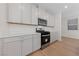 Stainless steel appliances and gray cabinets in a modern kitchen at 9062 Lucky Crest St, Las Vegas, NV 89113