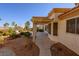 Backyard with covered patio, plants, and gravel landscaping offers relaxation at 9524 Quail Ridge Dr, Las Vegas, NV 89134