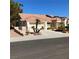 Single-story home with a desert landscape and a terracotta-colored tile roof at 9524 Quail Ridge Dr, Las Vegas, NV 89134