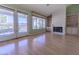 Living room with a fireplace, built-in bookshelves, and sliding glass doors at 9524 Quail Ridge Dr, Las Vegas, NV 89134