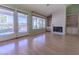 Bright living room with light-colored hardwood floors and large windows for natural light at 9524 Quail Ridge Dr, Las Vegas, NV 89134