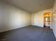 Bedroom with neutral carpet, and a door leading to the bathroom at , Henderson, NV 89014