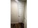 Hallway with dark wood-style floors and a door leading to another room at , Henderson, NV 89014