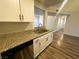 Updated kitchen featuring granite countertops, a stainless steel sink, and white cabinets at , Henderson, NV 89014