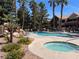 Resort-style pool area with palm trees, lounge chairs, and a spa, perfect for relaxation and community gatherings at , Henderson, NV 89014