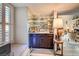 Elegant bar area featuring mirrored shelves, dark wood cabinets, and a cozy window seat at , Las Vegas, NV 89109