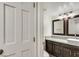 Bathroom with double vanity, granite counters, decorative mirrors and modern lighting at , Las Vegas, NV 89109