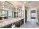 Bathroom vanity featuring a full wall mirror, granite countertop and ample cabinet space at , Las Vegas, NV 89109