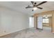 Spacious bedroom with plush gray carpeting, ceiling fan, and mirrored closet doors at , Las Vegas, NV 89109