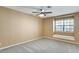 Bedroom featuring large windows with seat, ceiling fan, and neutral color walls at , Las Vegas, NV 89109