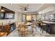 Cozy dining area with modern fan, adjacent to a kitchen with bar seating and backyard access at , Las Vegas, NV 89109