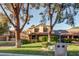 Inviting home exterior featuring mature trees, lush green lawn, and a charming front yard at , Las Vegas, NV 89109