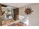 Inviting foyer with sun decoration, opening to a living space with wood floors and patio access at , Las Vegas, NV 89109