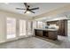 Open kitchen showcases a ceiling fan, island and bright windows overlooking the yard at , Las Vegas, NV 89109