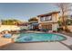 Backyard pool and patio area with ample seating, landscaping, and a relaxing spa at , Las Vegas, NV 89109