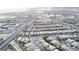 Overhead shot shows residential area near commercial zone and green athletic fields at 10212 Cider Mill Rd, Las Vegas, NV 89135