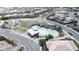 Aerial view shows a community pool, play area, and neighborhood streets at 10212 Cider Mill Rd, Las Vegas, NV 89135