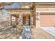 Front entrance with stonework and covered porch at 10212 Cider Mill Rd, Las Vegas, NV 89135