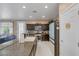 Open concept kitchen with a large island and a light-colored refrigerator at 10212 Cider Mill Rd, Las Vegas, NV 89135