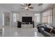 Living room with sectional sofa and large TV at 10212 Cider Mill Rd, Las Vegas, NV 89135