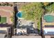 Aerial view of private backyard oasis featuring pool, patio, outdoor kitchen, and seating at 1163 Highbury Grove St, Henderson, NV 89002