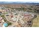 Overhead shot of community park with playgrounds, a basketball court, and walking paths near homes at 1163 Highbury Grove St, Henderson, NV 89002