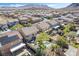 Aerial view of multiple residential backyards featuring pools and entertainment areas with beautiful mountain views in the distance at 1163 Highbury Grove St, Henderson, NV 89002