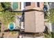 Aerial view of a backyard oasis featuring a refreshing pool, patio, dining area and lush trees for privacy at 1163 Highbury Grove St, Henderson, NV 89002