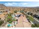 Aerial view showcases multiple pools and houses of the neighborhood at 1163 Highbury Grove St, Henderson, NV 89002