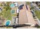 Aerial view of backyard oasis featuring pool, patio, seating and outdoor kitchen at 1163 Highbury Grove St, Henderson, NV 89002