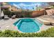 Backyard oasis with a tranquil pool, surrounded by lush greenery and a patio area for entertaining at 1163 Highbury Grove St, Henderson, NV 89002