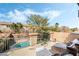 Upstairs view of patio featuring seating, lounge chairs, and a view of the refreshing pool at 1163 Highbury Grove St, Henderson, NV 89002