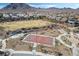 Outdoor basketball court at the community park, featuring play area, benches and desert landscaping at 1163 Highbury Grove St, Henderson, NV 89002