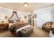 Relaxing bedroom with patterned bedding and a decorative canopy over the bed at 1163 Highbury Grove St, Henderson, NV 89002