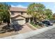 Two-story home featuring a well-manicured front yard and attached two-car garage and beautiful desert landscaping at 1163 Highbury Grove St, Henderson, NV 89002