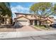 Charming two-story home with a well-kept lawn, a two car garage and brick driveway at 1163 Highbury Grove St, Henderson, NV 89002